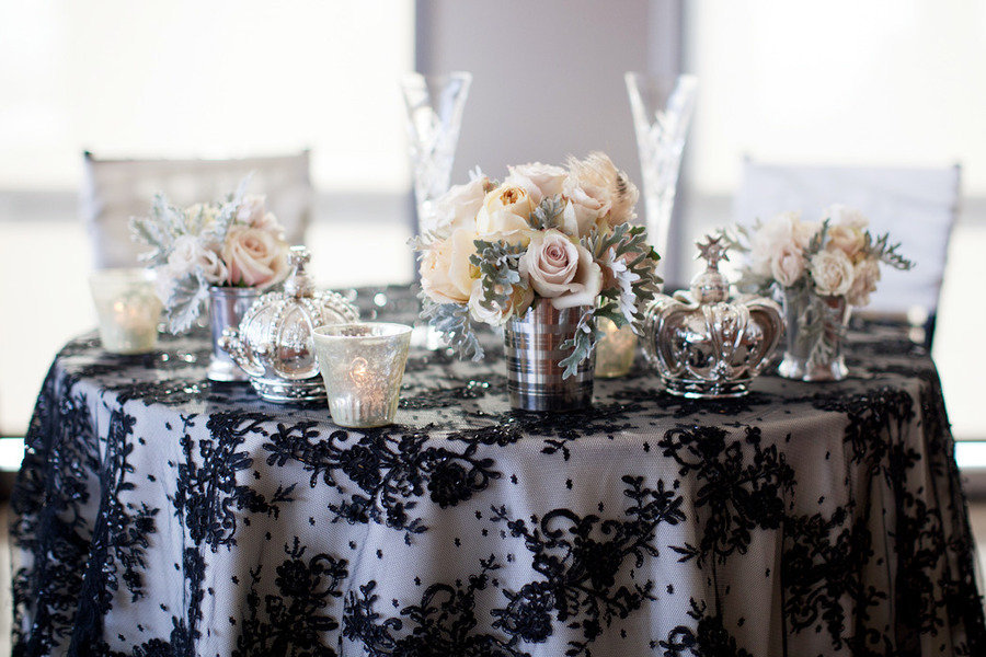 Elegant-wedding-tablescape-black-lace-overlay-silver-vases-candles.full