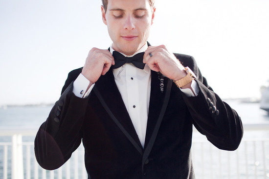 photo of Handsome grooms wearing tuxes and suits, elegant boutonnieres