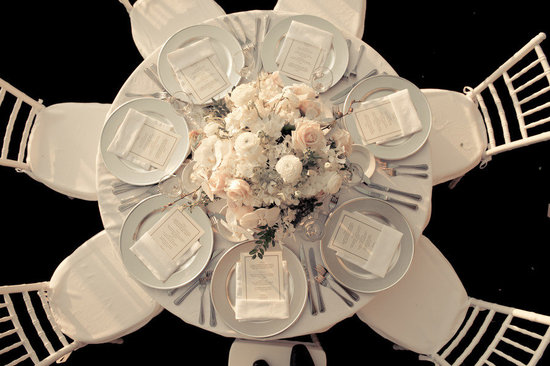 photo of elegant wedding reception venue ivory blush nude wedding flower centerpiece