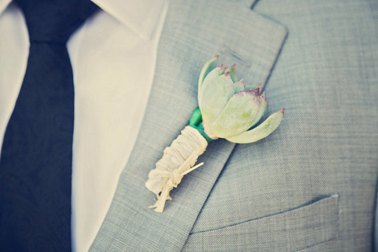 photo of Handsome grooms wearing tuxes and suits, elegant boutonnieres