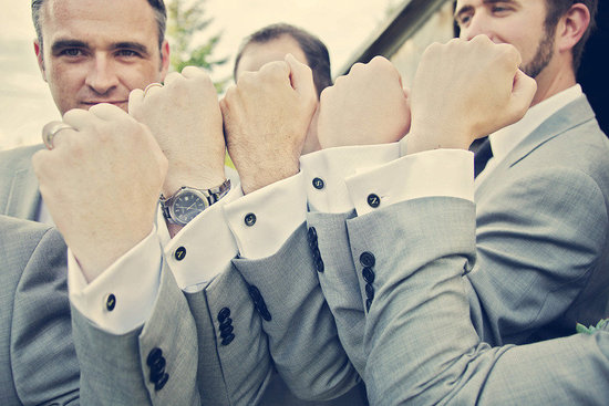 photo of Handsome grooms wearing tuxes and suits, elegant boutonnieres
