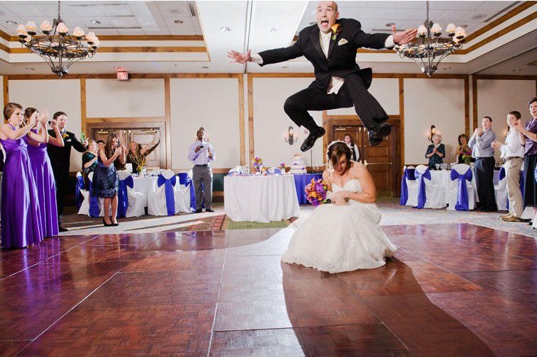 Memorable-wedding-photos-day-of-photography-groom-jumps-bride-during-first-dance.full