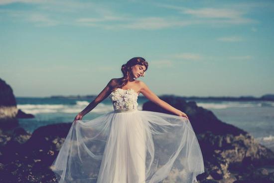 Bohemian bride at a beach wedding bridal gown beauty inspiration.