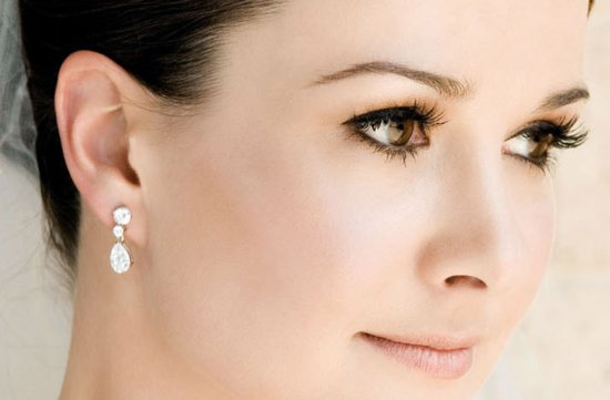 photo of bridal beauty inspiration wedding hair makeup warm tones classic updo