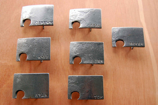 photo of rad wedding gifts for groomsmen best man belt buckles beer openers