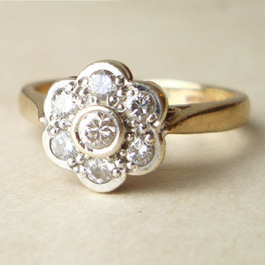 photo of Vintage .25 Carat Diamond Daisy Flower Ring, $385